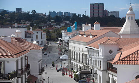 Cayala's main street, with Guatemala City, the capital, in the background. (theguardian.com)