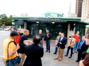 Cliff Wood, with box, leads tour. (Photo by David Brussat)