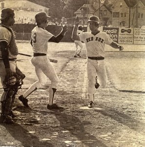 Wade Boggs, center, with Marty Barrett, played in the 33-inning game.