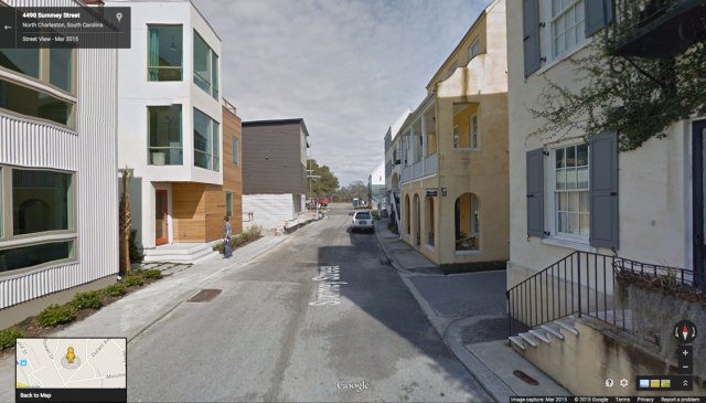 The modern and traditional architecture on either side of this street are part of the same project in Charleston.